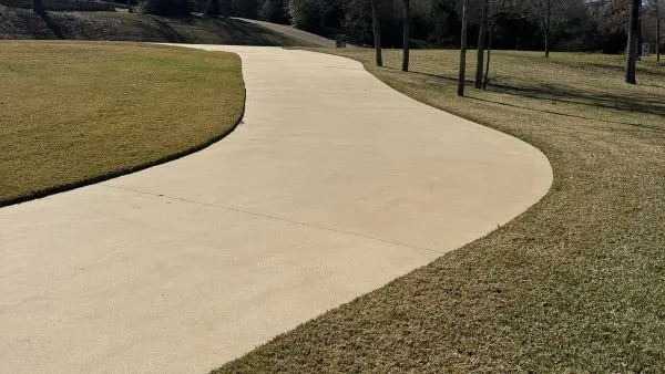 Residential driveway after pressure washing by Stonevale Exterior Co. showing clean restored concrete