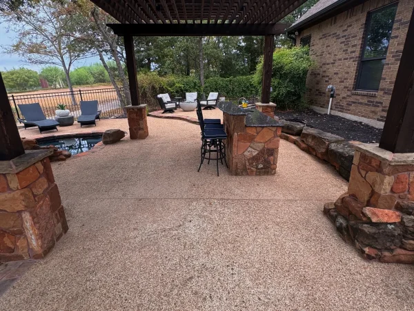 Stone patio and outdoor living area after professional cleaning by Stonevale Exterior Co. showing restored surfaces