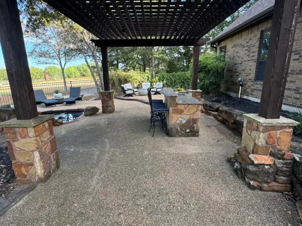 Stone patio and outdoor living area before professional cleaning by Stonevale Exterior Co.