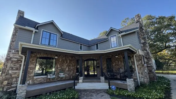 Petrified stone home exterior after cleaning by Stonevale Exterior Co. showing clean siding and restored stonework